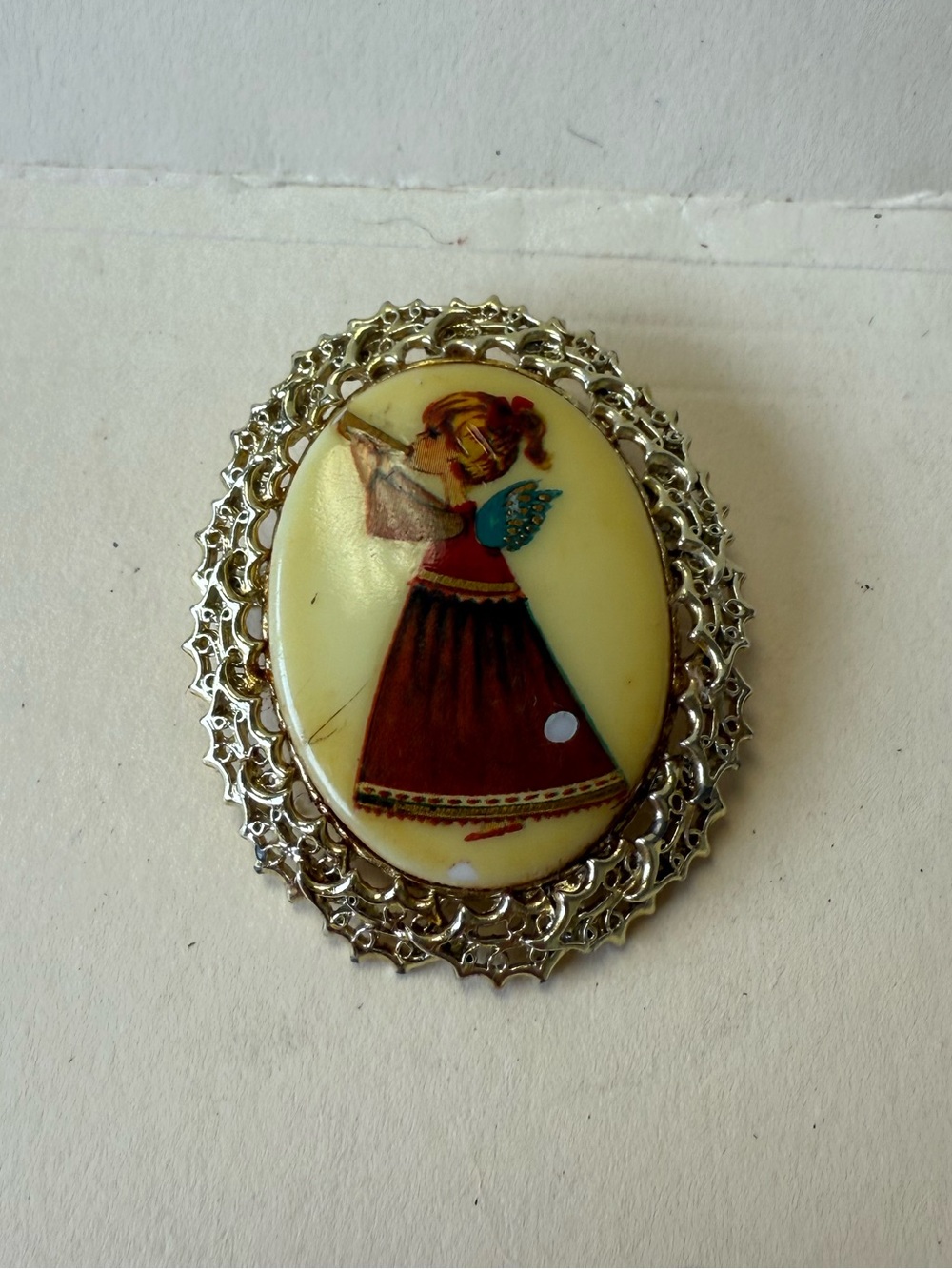 Vintage Gold Tone Holiday Angel In Red Dress with Trumpet Oval Pin Brooch.